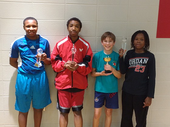 Members of the junior team of the South Bend Table Tennis Club display their trophies. From left to right Dion Payne Miller, Dominique Clark, Marty Stoner and Dionta Payne Miller.