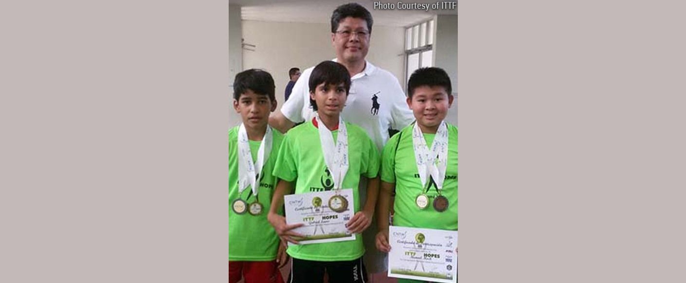 Emilo Wong, President of Panama Table Tennis Association, with the leading young players Photo By: Courtesy of Emelio Wong